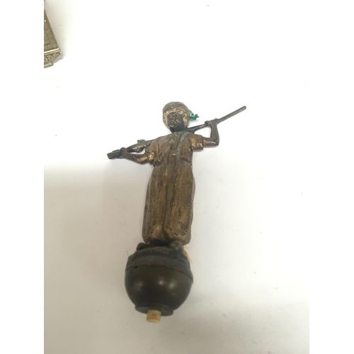 712 - A cold painted Bronze possible Austrian in the form of a Middle Eastern figure with a gun. The figur... 