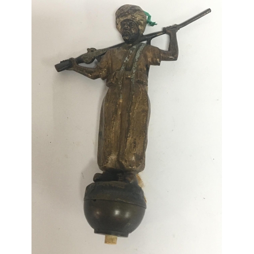 712 - A cold painted Bronze possible Austrian in the form of a Middle Eastern figure with a gun. The figur... 