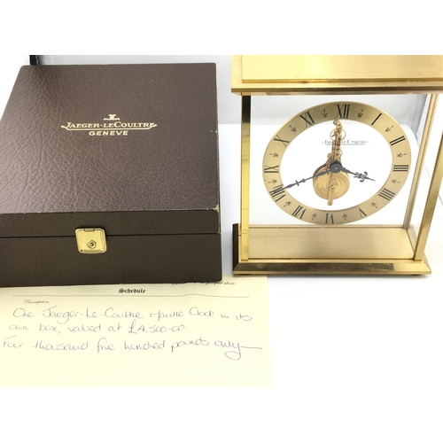 738 - A Jaeger LeCoultre mantle clock with own fitted box. Winds and runs. 16cm wide and 17cm tall. Postag... 