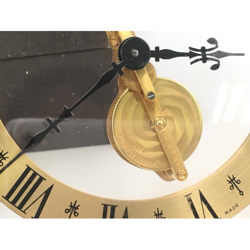 738 - A Jaeger LeCoultre mantle clock with own fitted box. Winds and runs. 16cm wide and 17cm tall. Postag... 