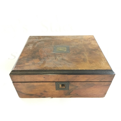 743 - A walnut box. 30x24x13. Postage B