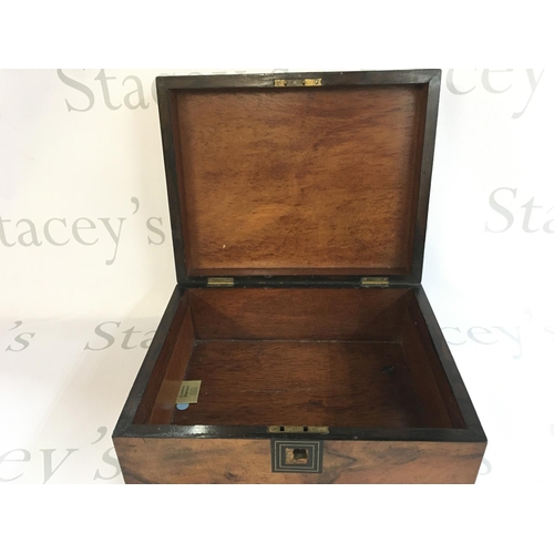 743 - A walnut box. 30x24x13. Postage B