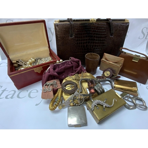 769 - A mixed collection of vintage handbags, compacts and buckles and vintage costume jewellery (C)