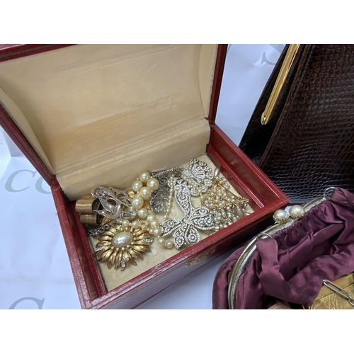 769 - A mixed collection of vintage handbags, compacts and buckles and vintage costume jewellery (C)