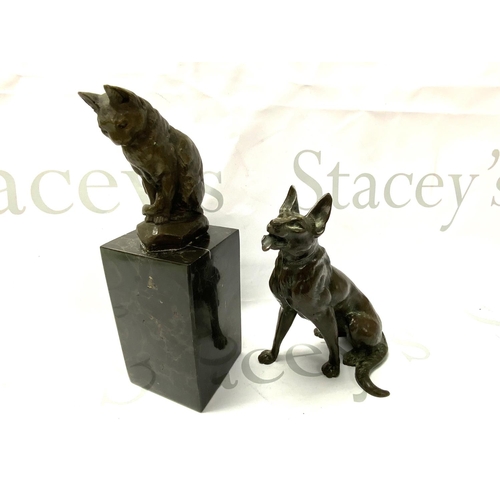 777 - A bronze seated figure of an Alsatian together with a bronze model of a cat on marble base. 16cm/21c... 