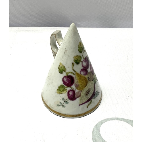 802 - A small possibly Chelsea porcelain candle snuff with hand painted fruit decoration. (Some restoratio... 