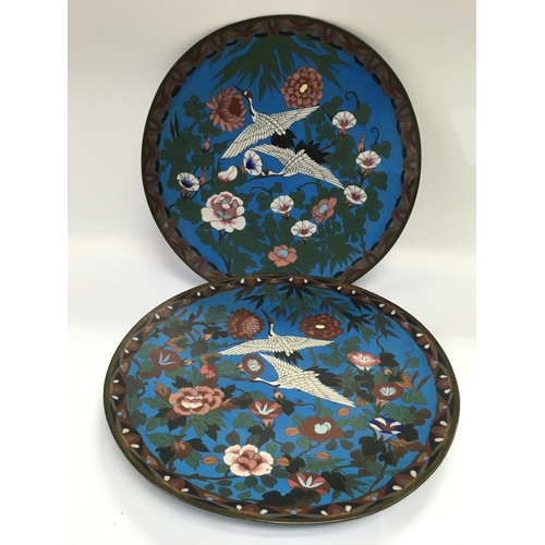 810 - A pair of cloisonne dishes decorated with storks, approx diameter 30cm. Shipping category D. NO RESE... 