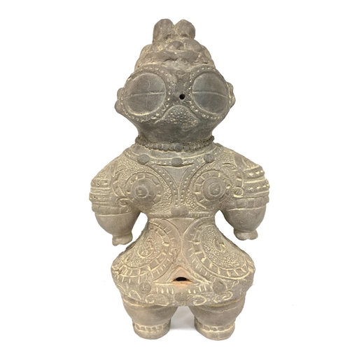 823 - A Japanese Terracotta Dogu figurine of a pregnant woman, 29.5cm high