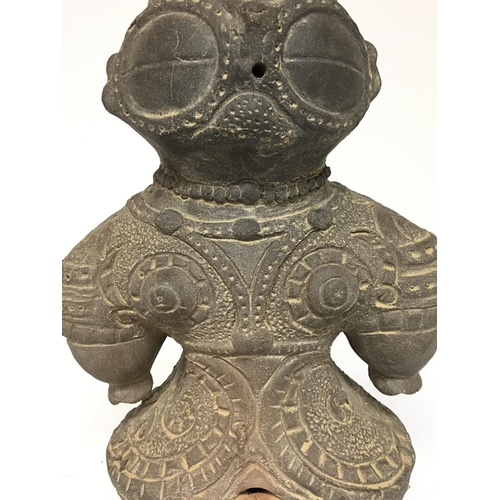 823 - A Japanese Terracotta Dogu figurine of a pregnant woman, 29.5cm high