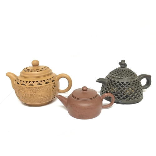 825 - Three Chinese Yixing teapots. 5 to 9cm tall approximately. Restoration seen on smallest teapot This ... 