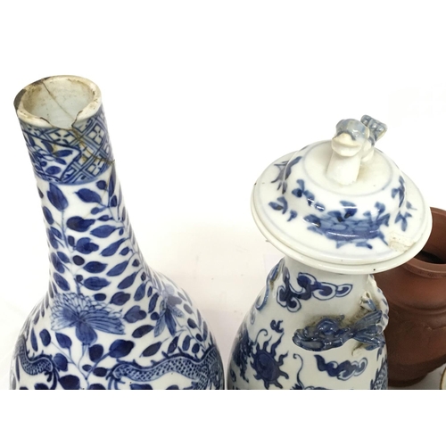 831 - A Collection of Chinese ceramics including blue and white plates and vases with dragon decoration. D... 