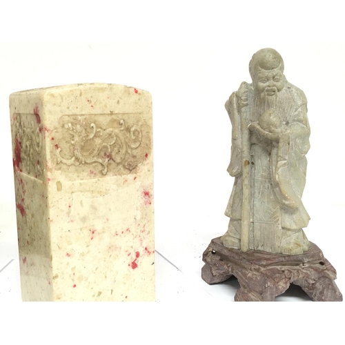 835 - A collection of soapstone including a Sage figure (20.5cm tall), a seal (17.5cm tall), a soapstone d... 