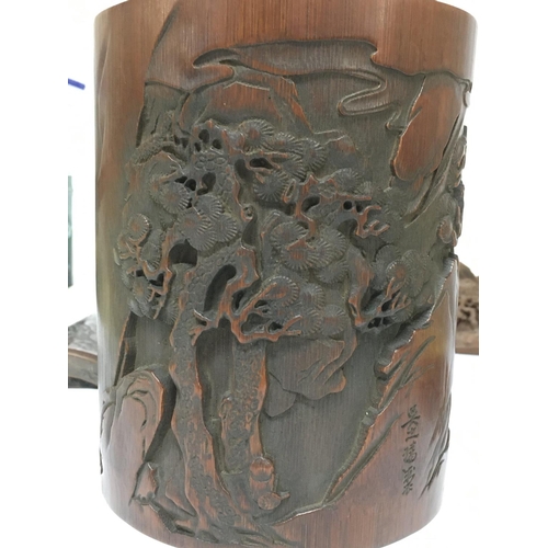 838 - Chinese items including a bamboo brush pot with hand carved scene design, a bamboo wrist rest, a woo... 