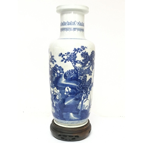 840 - A 19th century Chinese blue and white vase with pheasant and cherry blossom tree decoration. 47.5cm ... 