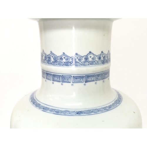 840 - A 19th century Chinese blue and white vase with pheasant and cherry blossom tree decoration. 47.5cm ... 