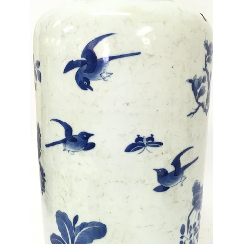 840 - A 19th century Chinese blue and white vase with pheasant and cherry blossom tree decoration. 47.5cm ... 