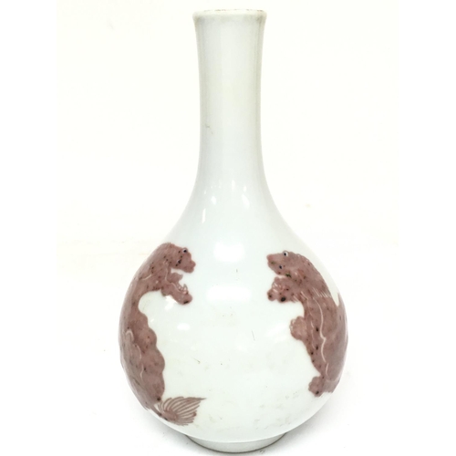 844 - A Chinese Buddhist lions porcelain vase. 23.5cm tall approximately. No obvious large damage or resto... 