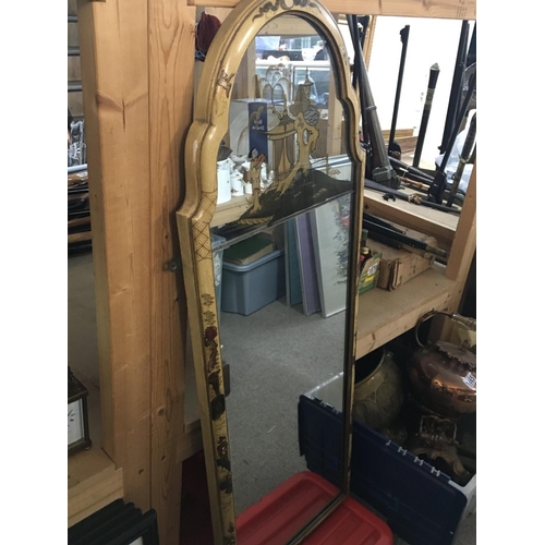 852 - An arched Japanese style mirror. 105cm tall. This lot cannot be posted