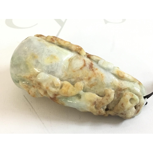 856 - A Chinese carved Jade pebble , 9cm long this lot cannot be posted