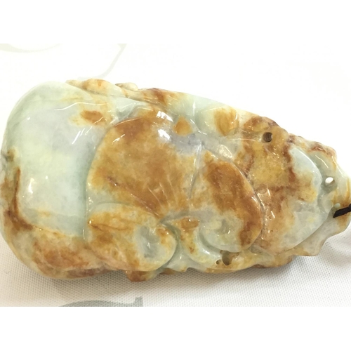 856 - A Chinese carved Jade pebble , 9cm long this lot cannot be posted