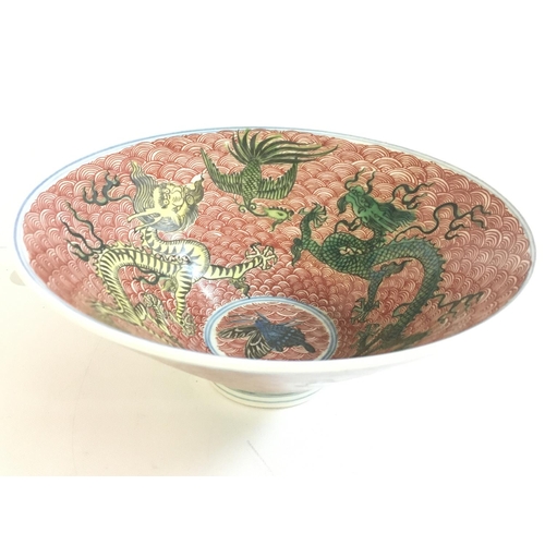 862 - A Chinese Dragon and Crane porcelain bowl . Six figure mark at the base. 7cm tall, 16cm wide. This l... 