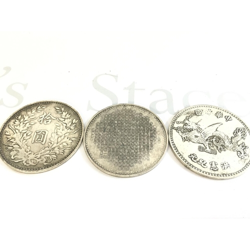 867 - Three large Chinese coins, 8.5cm wide approximately. Postage category A