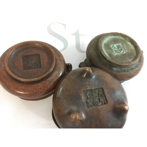 872 - A collection of Chinese bronze censers, 8cm wide approx. Postage category B