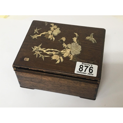 876 - A late 19th century Japanese hardwood box decorated with raised and applied bone and mother of pearl... 