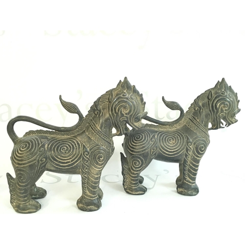 880 - Two bronze temple dog Thai figures, 20cm tall. Postage category B