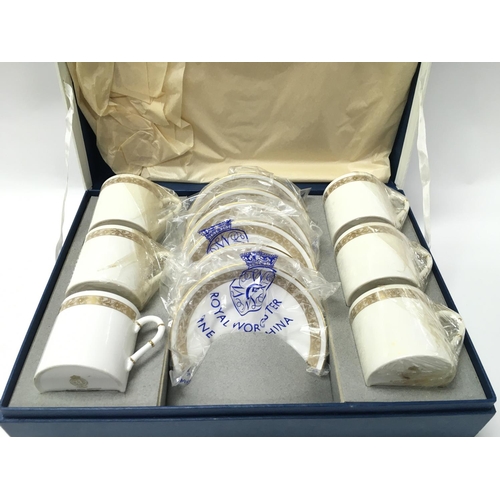 902 - A boxed Royal Worcester coffee set. Postage D