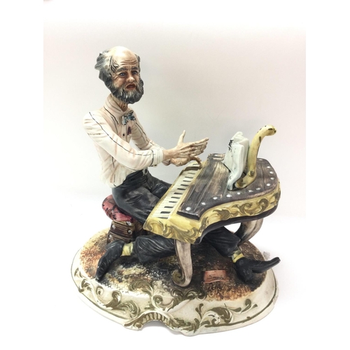 912 - A Capodimonte Pianist figure, 30cm tall. This lot cannot be posted. NO RESERVE