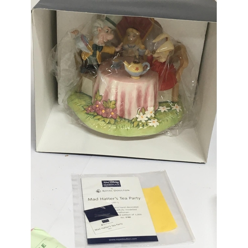 941 - A Royal Doulton boxed as new Disney Showcase figure group The Mad Hatters Tea Party. limited edition... 