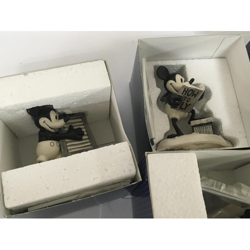 942 - Four boxed Disney Show Case figures Mickeys one man band all in black and white glaze with limited e... 