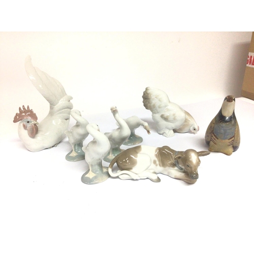 951 - WITHDRAWN - A collection of Lladro animals and birds chickens a calf a Partridge and geese no obviou... 