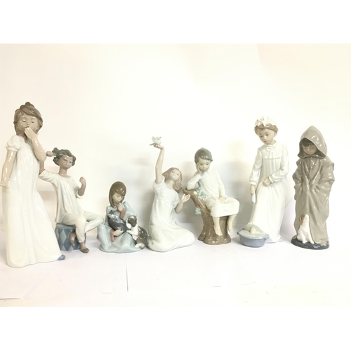 958 - A collection of porcelain Lladro figures , 15 to 30cm tall. this lot cannot be posted