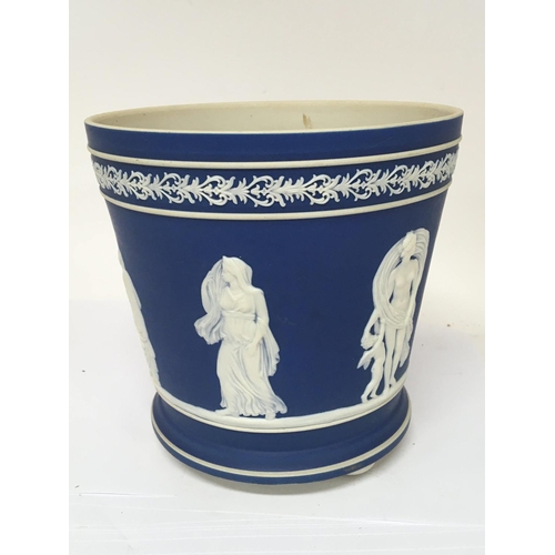 966 - A late Victorian Jasper ware jardiniere decorated with classical figures on a blue ground with small... 