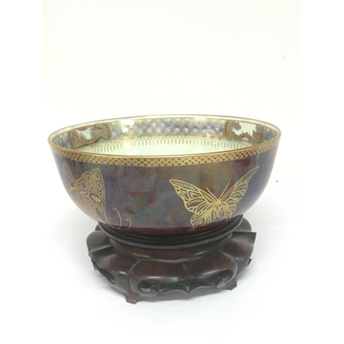 971 - A Quality Wedgwood lustreware bowl decorated with butterflies and panels of oriental buildings. The ... 