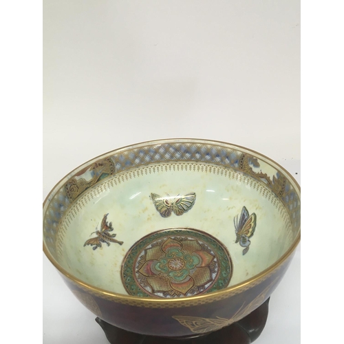 971 - A Quality Wedgwood lustreware bowl decorated with butterflies and panels of oriental buildings. The ... 