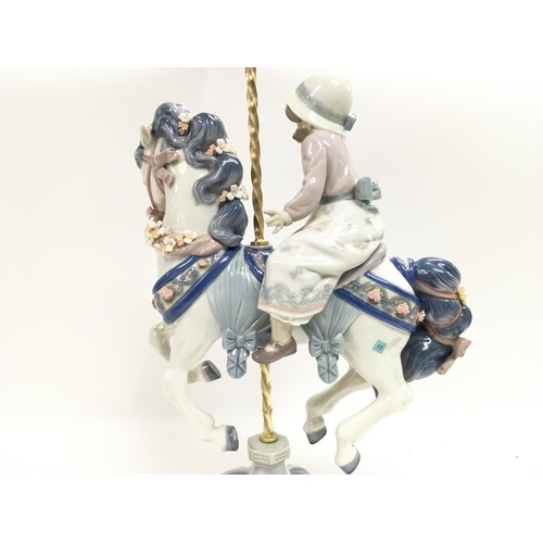 975 - A Lladro girl on a carousel horse porcelain figure. Some flowers missing however no obvious large da... 