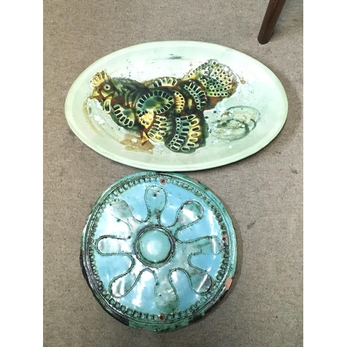 982 - Two art dishes including an oval ceramic cockerel design dish and a Turquoise wall dish. This lot ca... 