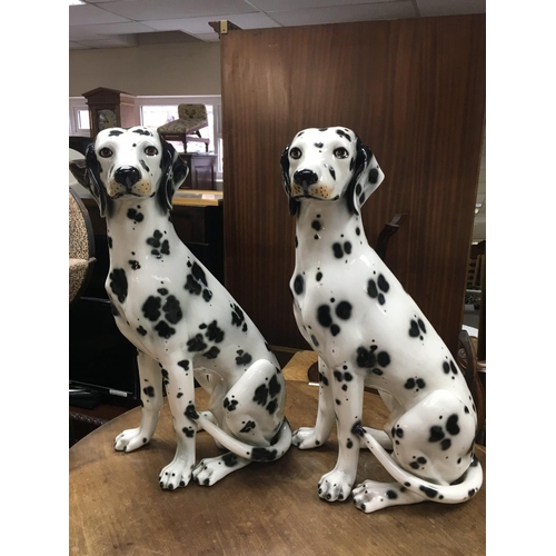 987 - A pair of Spanish Dalmatian ceramic figures. Approximately 71cm tall. This lot cannot be posted