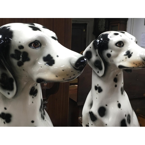 987 - A pair of Spanish Dalmatian ceramic figures. Approximately 71cm tall. This lot cannot be posted