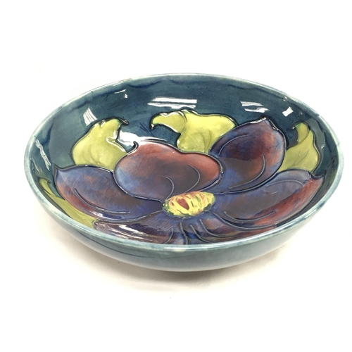 990 - A Moorcroft Anemone floral design dish , 14cm wide. This lot cannot be posted