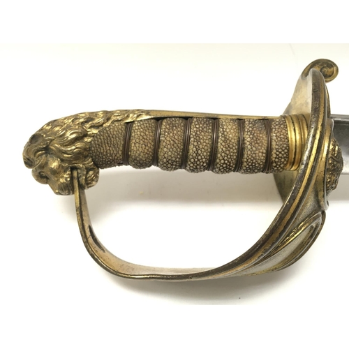 1490 - A naval officers dress sword with shagreen grip, brass hilt, lion heads pommel and a double fullered... 