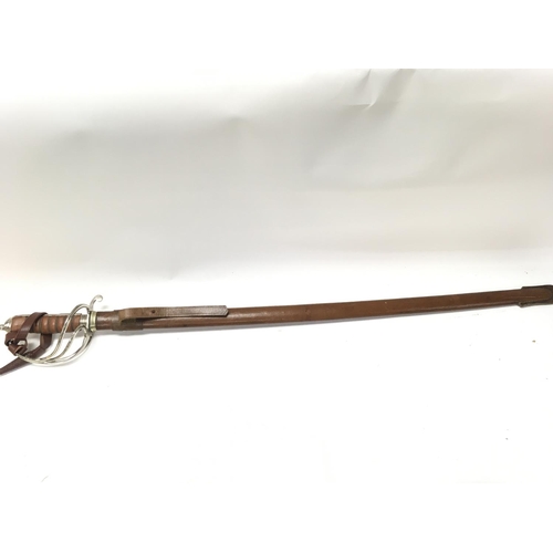 1491 - A Royal Artillery Officers sword by Wilkinson with a leather scabbard , 110cm total length. This lot... 