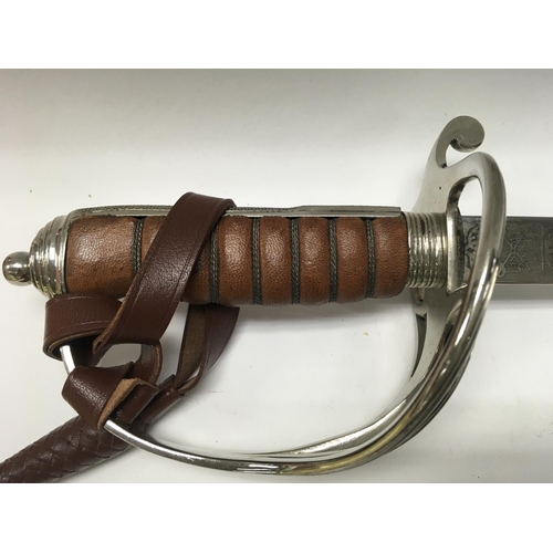 1491 - A Royal Artillery Officers sword by Wilkinson with a leather scabbard , 110cm total length. This lot... 