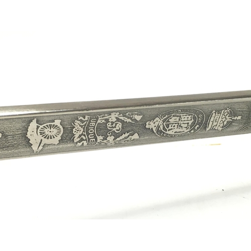 1491 - A Royal Artillery Officers sword by Wilkinson with a leather scabbard , 110cm total length. This lot... 