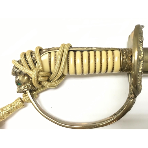 1495 - A 20th century naval officers dress sword with a brass hilt, lion head pommel , sword knot, unmarked... 