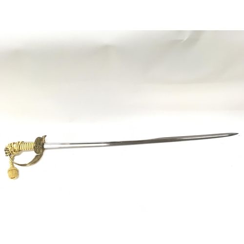 1495 - A 20th century naval officers dress sword with a brass hilt, lion head pommel , sword knot, unmarked... 