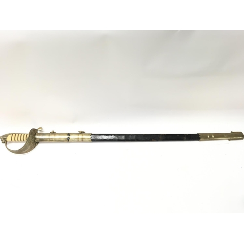 1496 - A naval officers dress sword with a brass hilt, lion head pommel, shagreen grip. 94cm total length. ... 